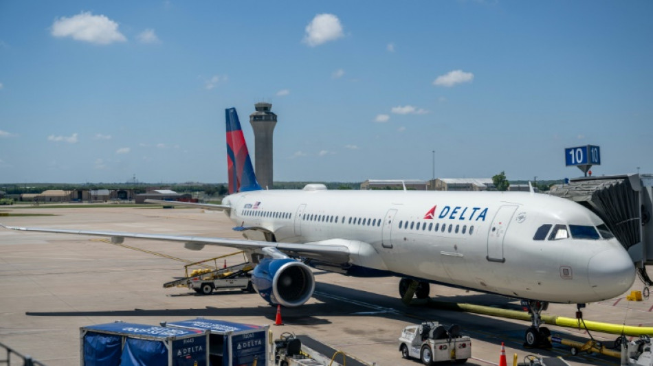 Delta reports profit jump but lowers earnings forecast