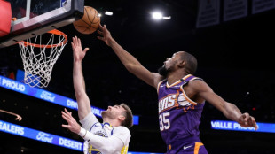 Durant and Booker lead NBA Suns over Warriors