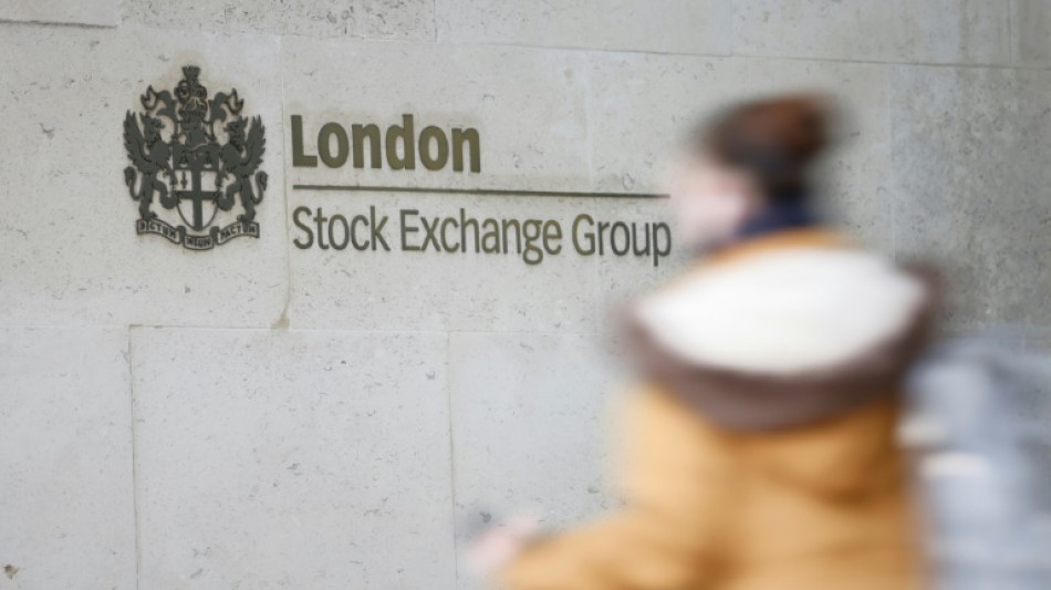 London stocks hit record peak, dollar drops before US inflation