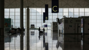 Hong Kong halves flight suspensions triggered by Covid cases