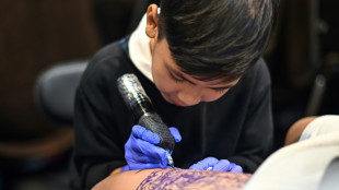 Nine-year-old Thai tattooist makes his mark