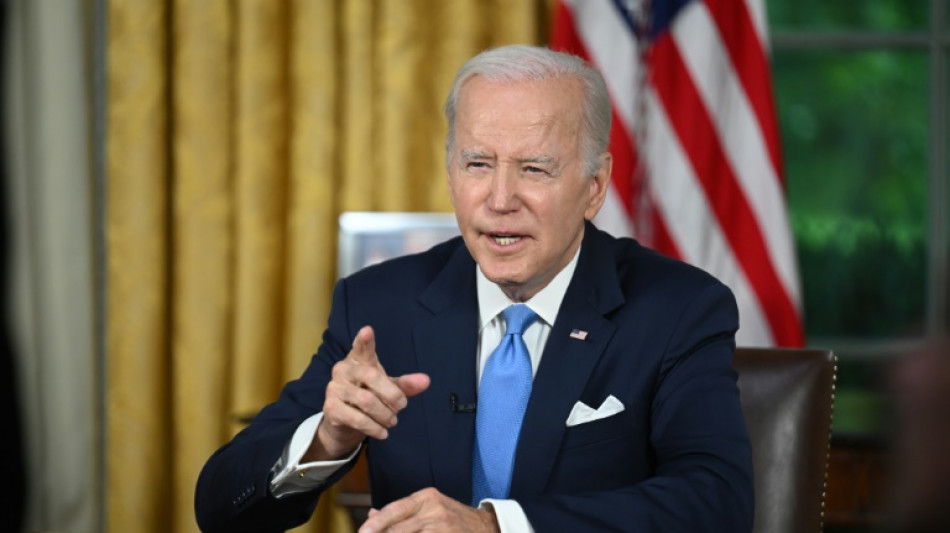 Biden signs debt ceiling bill into law, averting default