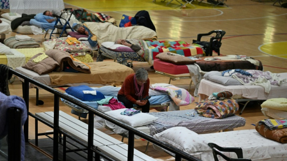 Friendship, hot meals for Italy's flood displaced