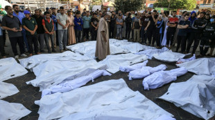 Gazans bury their dead in orchards and football fields