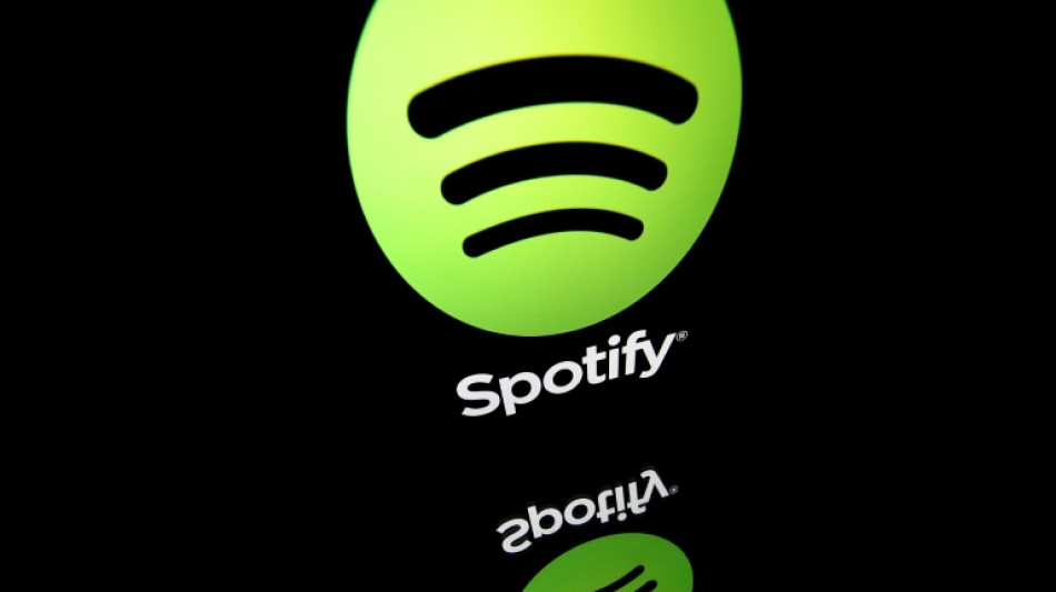 Spotify reports strong user growth, raises prices