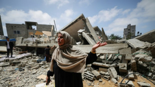 Gazans amid the rubble of homes flattened by fighting