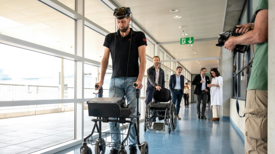 Paralysed man walks again via thought-controlled implants