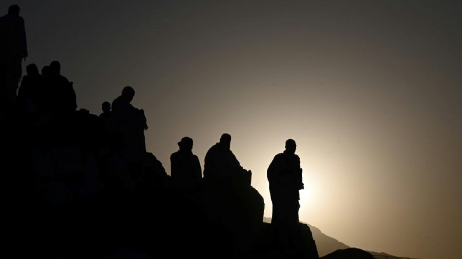 As temperatures climb, pilgrims ascend Mount Arafat in hajj climax