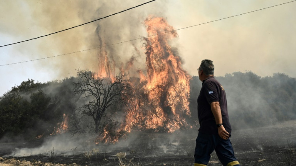 Greek fires death toll rises to 21 as firefighters battle on