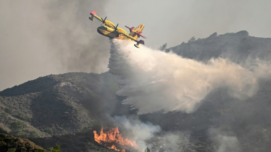 Greece faces new heatwave as wildfires rage