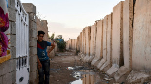 Years after civil war, security wall holds back Iraqi city